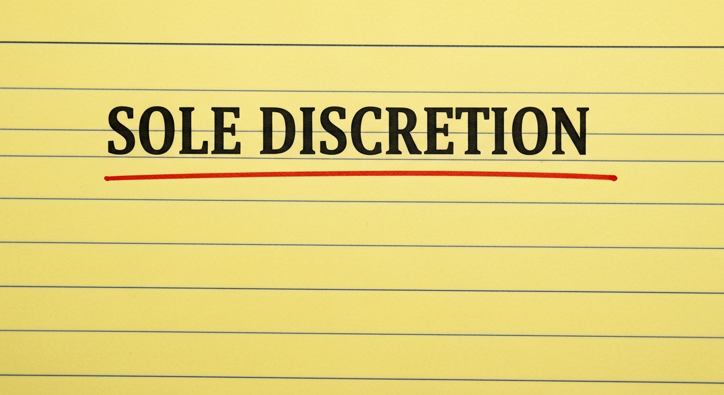 A red ink underline beneath the phrase SOLE DISCRETION on a yellow legal pad