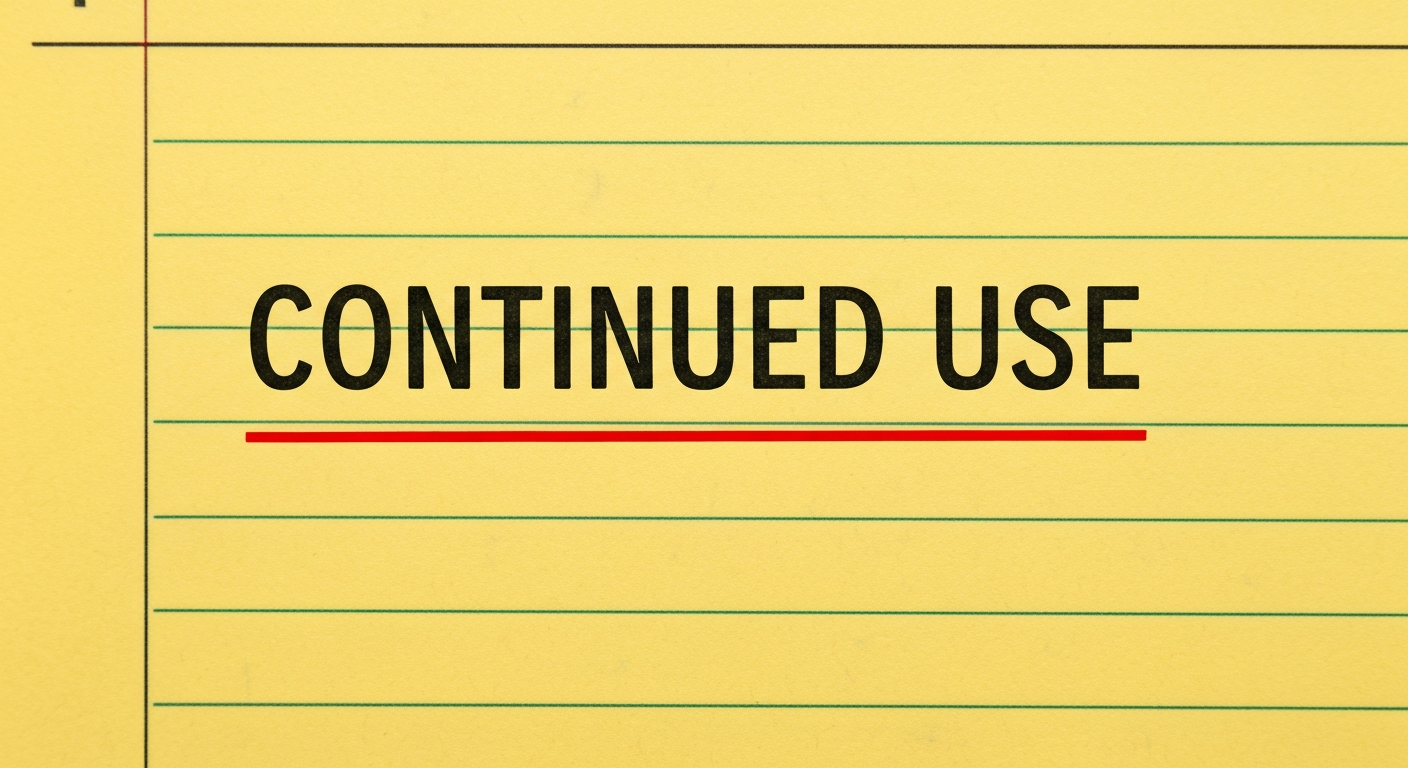 A red ink underline beneath the phrase CONTINUED USE on a yellow legal pad